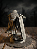 Erik of the Scarlett Road rear view showing cloak, quiver, and armor detail against a misty backdrop.