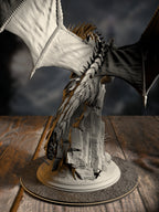 Gintharax rear view showing intricate silver scale detail and wing structure.