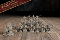 Group photo of all 17 painted-ready miniatures from the Law & Disorder campaign bundle, with a Ready to Play banner listing miniatures, campaign book, character sheets, and battle sheets.