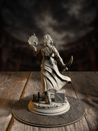Front-angled view of Kira Solseth miniature showing her corset, flowing cloak, and crate-and-bottle-strewn base