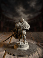 Knight miniature in heavily feathered owl-motif armor, standing over scattered scrolls and rubble, greatsword strapped to the back