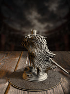 Rear view of Eulysses miniature showing the full feathered cloak, plumed pauldrons, and sheathed greatsword