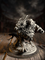 Three-headed chimera miniature with goat horns, twin roaring beast heads, and a serpent tail, crouched in a pouncing stance