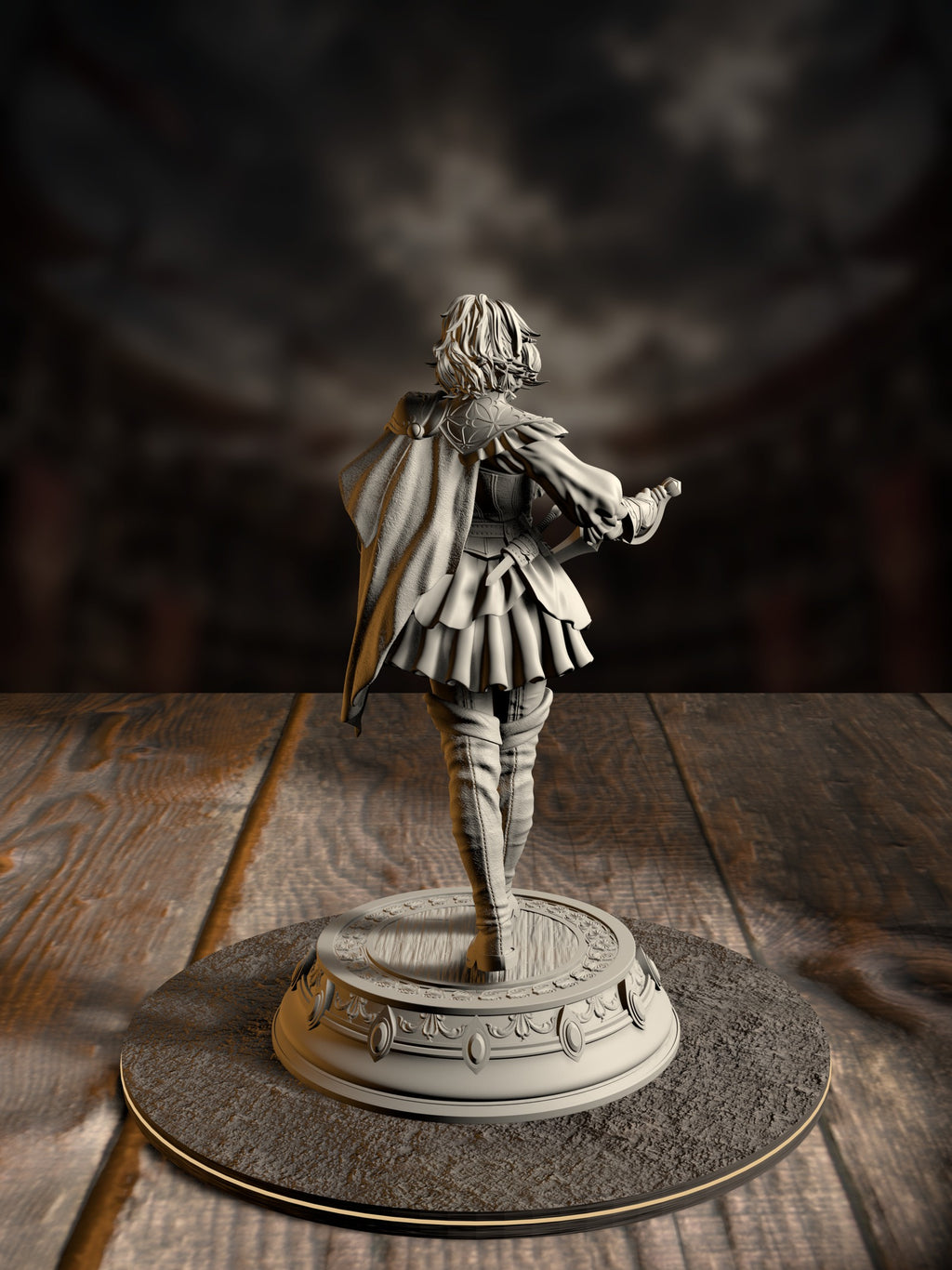 Side view of the Lady Duellist miniature showing her cape, bracers, and poised dueling stance atop an ornate round base