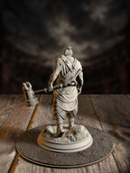 Rear view of Sindan the Southern Hammer miniature showing his topknot, layered wrap armor, and hammer follow-through